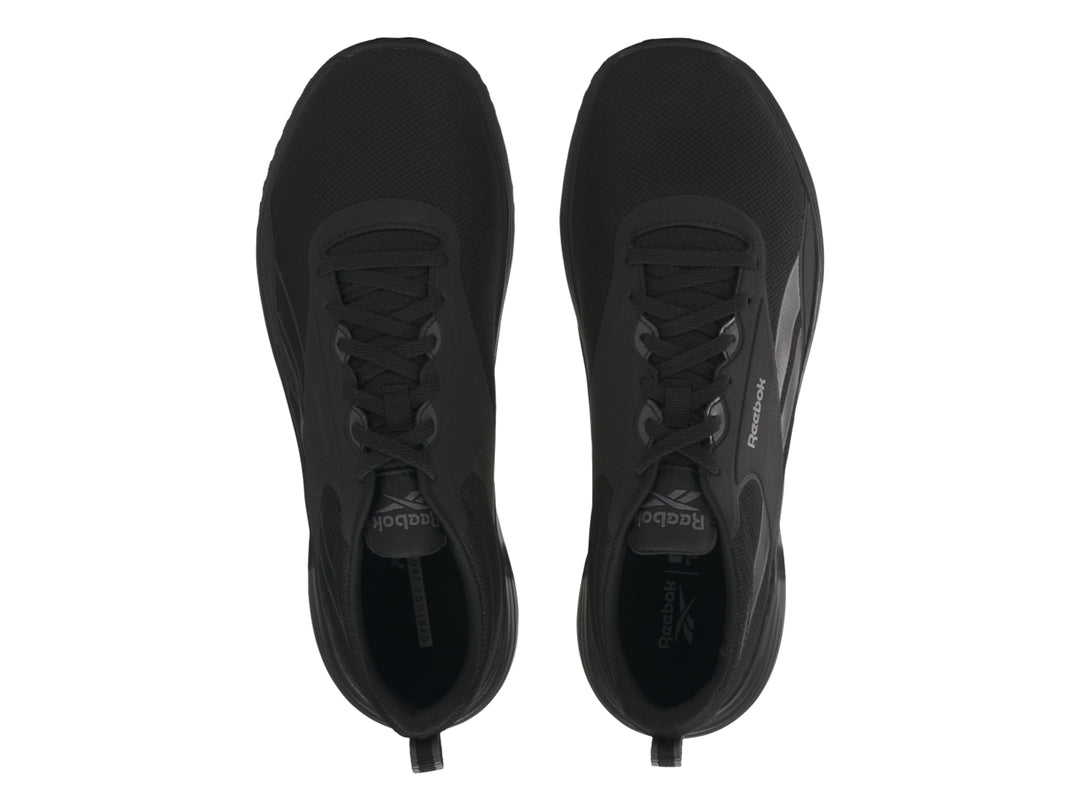 Tenis deportivos Reebok Lite Plus 4 en color negro con detalles en gris y suela negra.