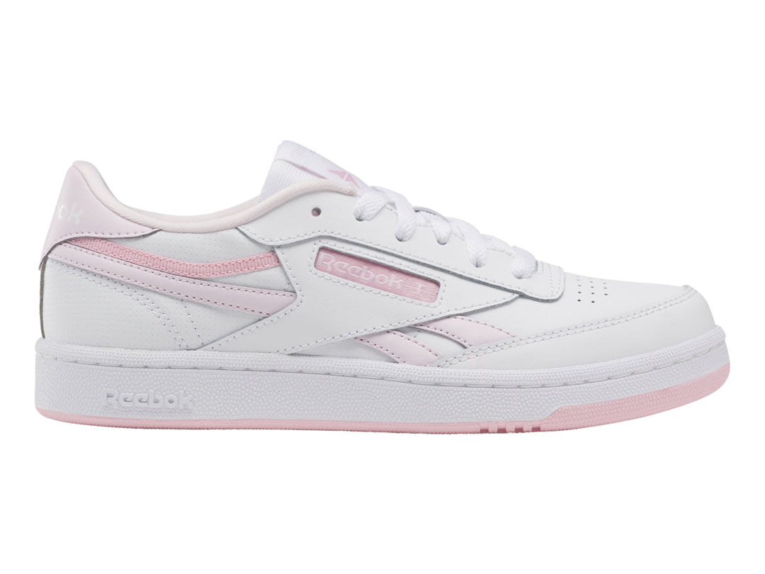 Tenis Reebok blancos con detalles y suela en color rosa, estilo casual deportivo.