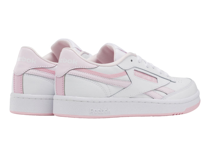 Tenis Reebok blancos con detalles y suela en color rosa, estilo casual deportivo.