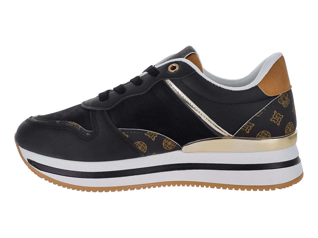 Tenis ATOK color negro con detalles dorados y suela blanca y café.