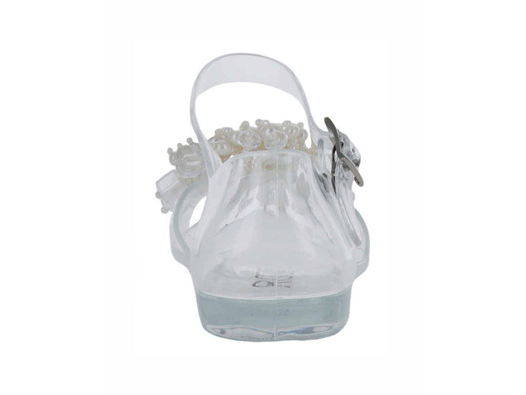Sandalia transparente para niña con detalle de perlas blancas en la punta y correa con hebilla.