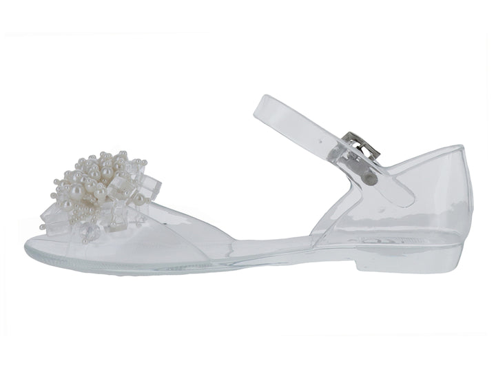 Sandalia transparente para niña con detalle de perlas blancas en la punta y correa con hebilla.