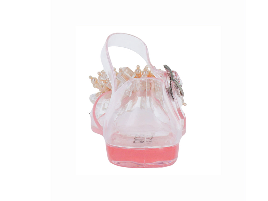 Sandalia transparente para niña con detalles de perlas decorativas en la punta y correa ajustable rosa.