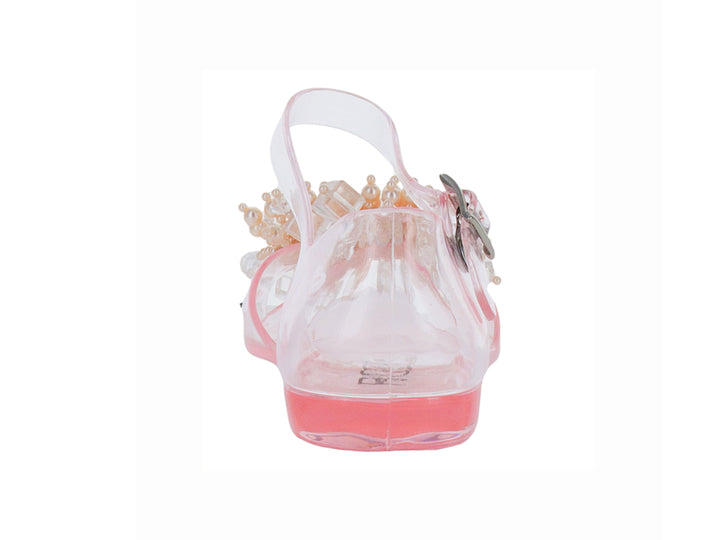 Sandalia transparente para niña con detalles de perlas decorativas en la punta y correa ajustable rosa.