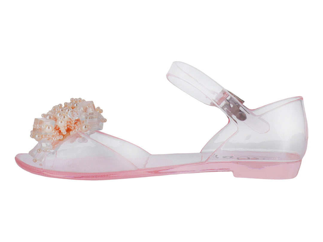 Sandalia transparente para niña con detalles de perlas decorativas en la punta y correa ajustable rosa.