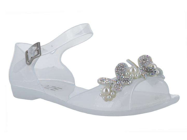 Sandalia blanca para niña con detalle de moño y perlas, correa ajustable y acabado brillante.