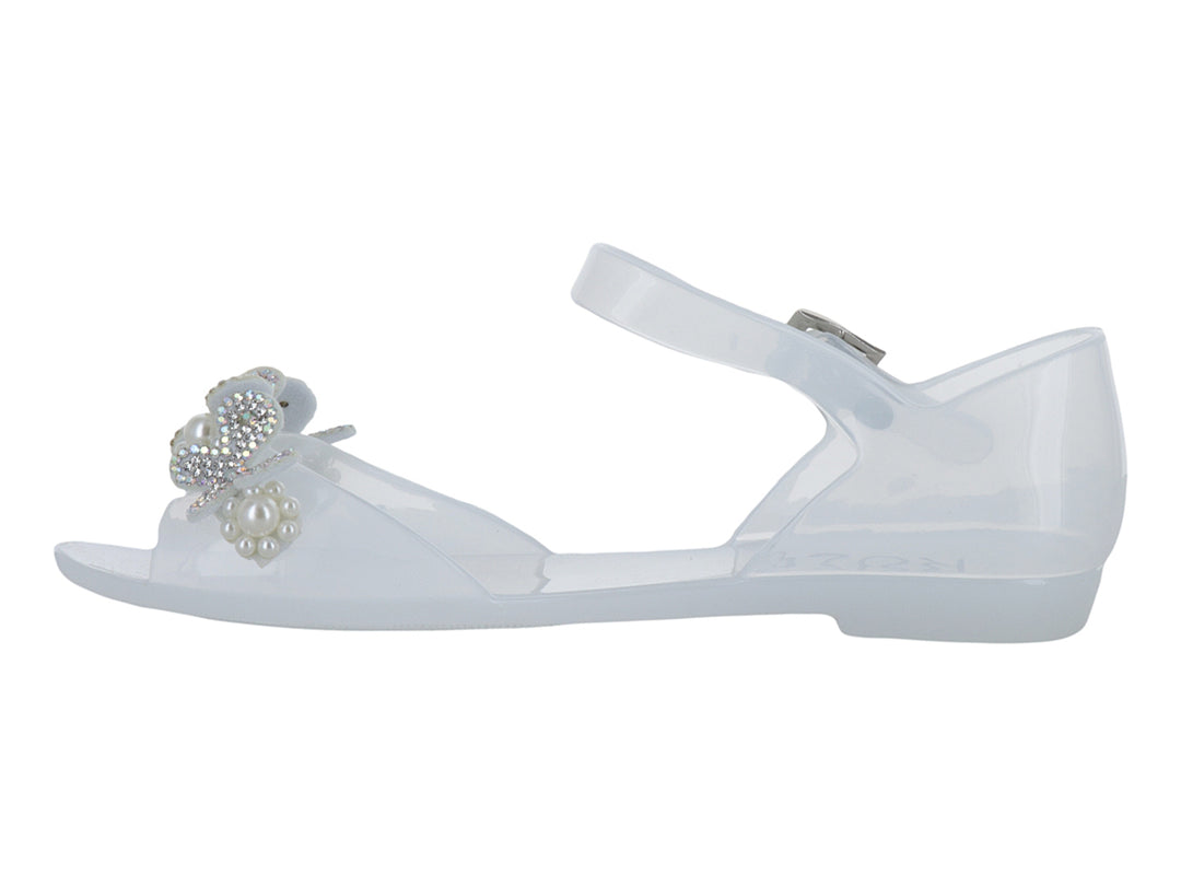 Sandalia blanca para niña con detalle de moño y perlas, correa ajustable y acabado brillante.