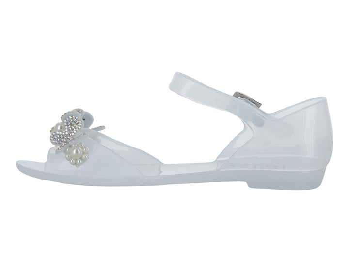 Sandalia blanca para niña con detalle de moño y perlas, correa ajustable y acabado brillante.