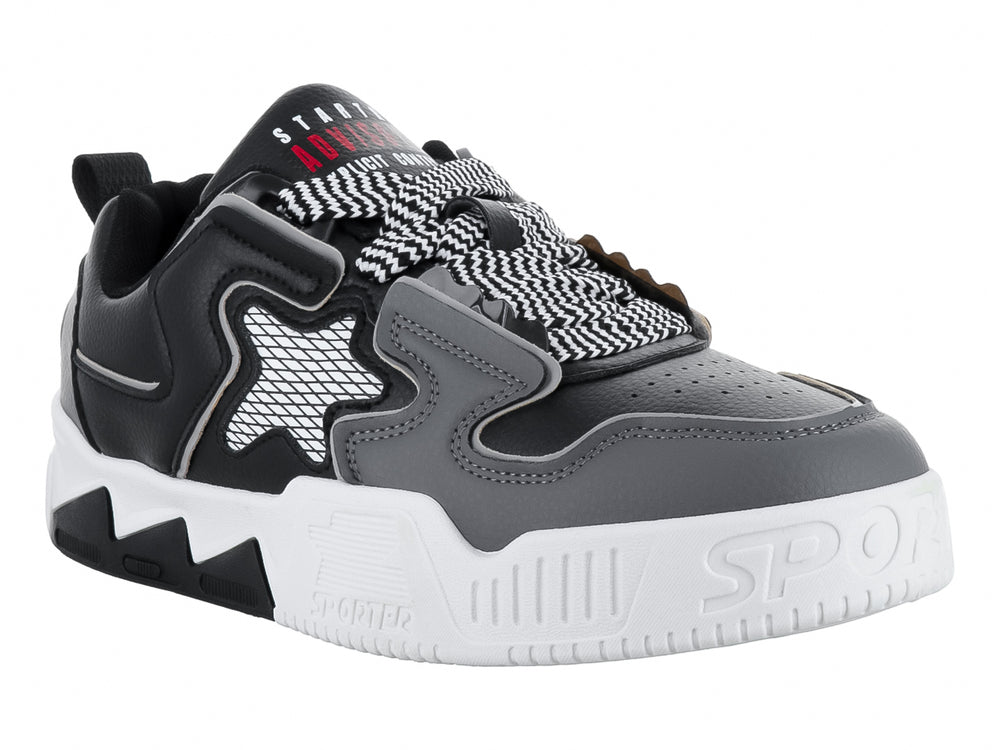 Tenis deportivos ZAEM color negro y gris con suela blanca y detalle de estrella en el costado.
