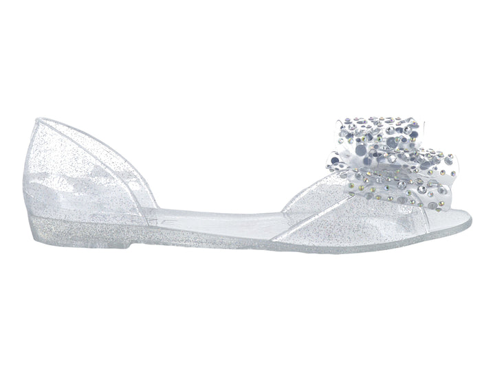 Zapato plano transparente con glitter y adorno de pedrería brillante en la punta para niña.