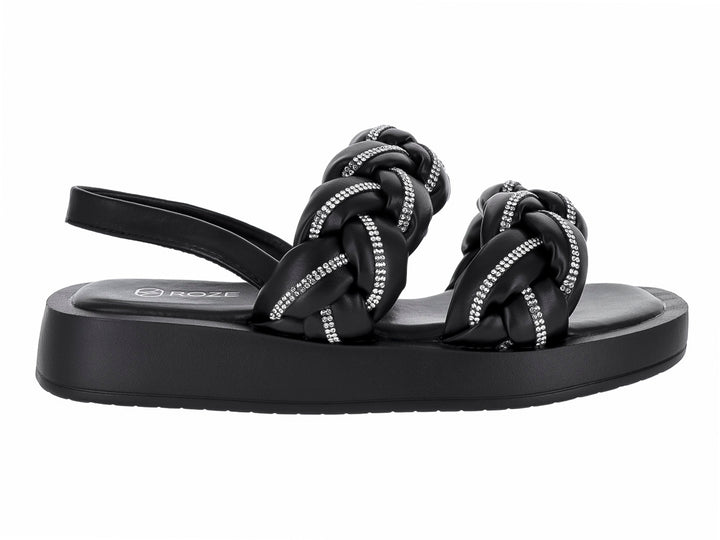 Sandalias negras de plataforma con tiras trenzadas decoradas con brillantes y correa posterior.