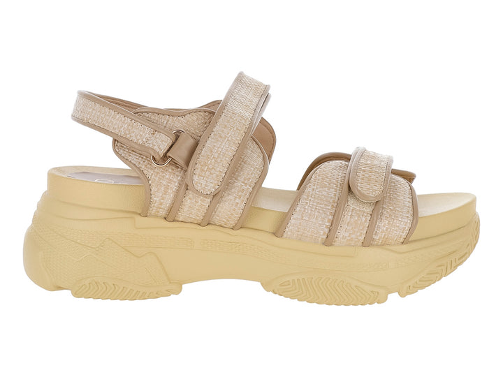 Sandalia de plataforma color beige con correas de tela y suela gruesa.