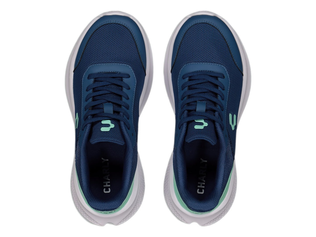 Tenis deportivos Charly color azul marino con detalle aqua en el talón y suela blanca.