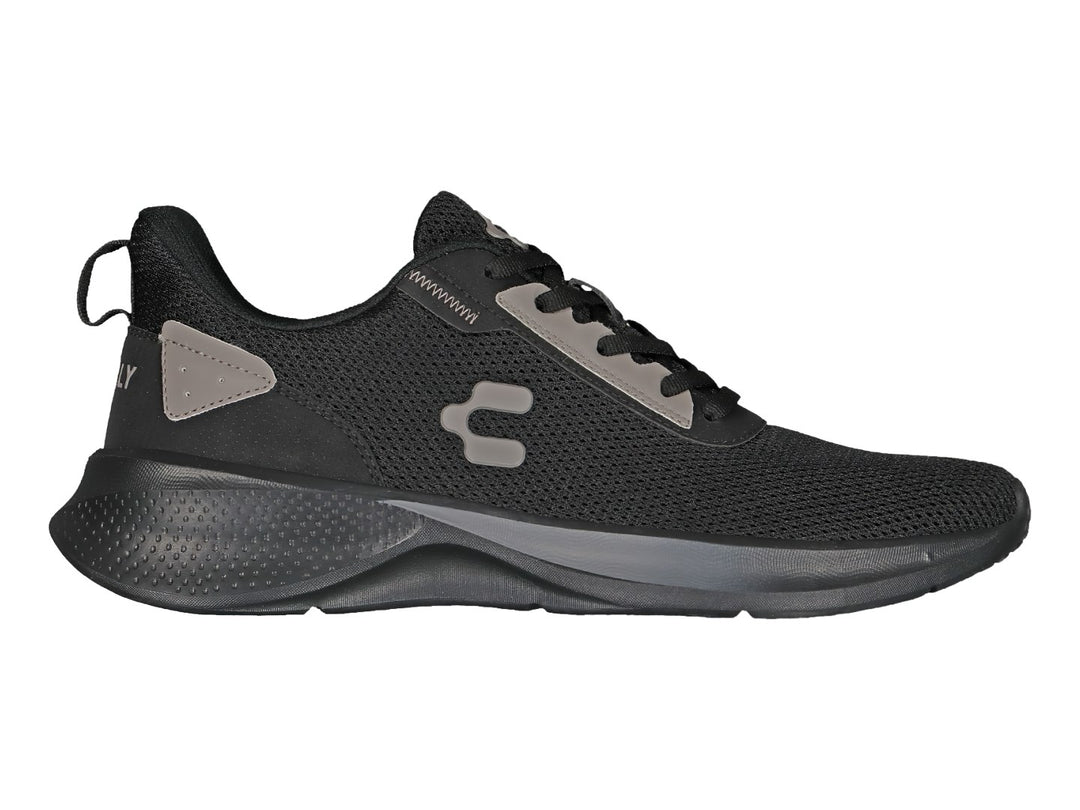 Tenis deportivos Charly color negro con detalles en gris y suela negra.