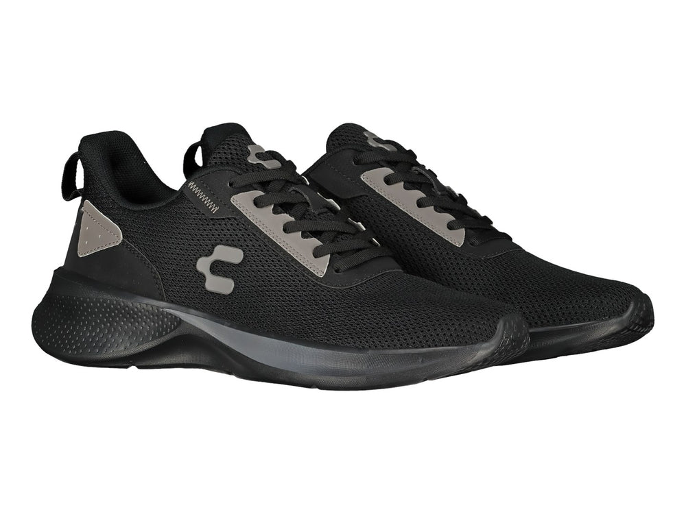 Tenis deportivos Charly color negro con detalles en gris y suela negra.