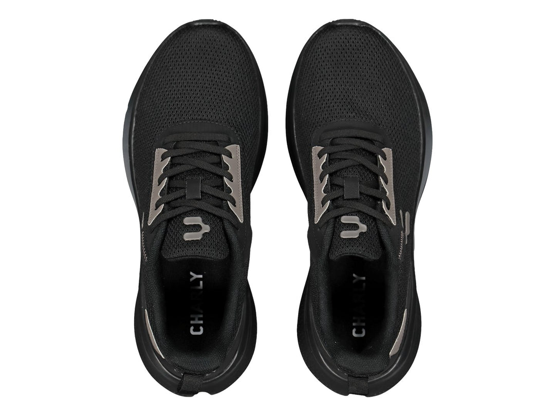 Tenis deportivos Charly color negro con detalles en gris y suela negra.