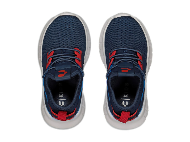 Tenis deportivos Charly color azul marino con suela blanca y detalles en rojo y azul claro.