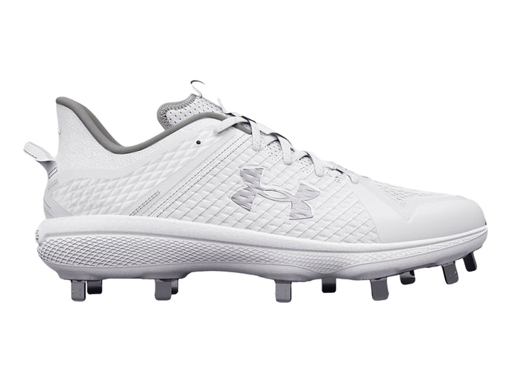 Zapato deportivo Under Armour blanco de corte bajo con tacos grises en la suela.