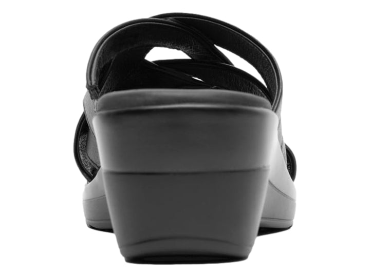 Sandalia Flexi color negro para mujer con diseño de tiras entrelazadas y suela de cuña cómoda.
