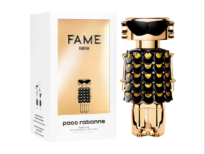 Frasco de perfume Paco Rabanne Fame Parfum en color dorado y negro con diseño artístico junto a su caja blanca.
