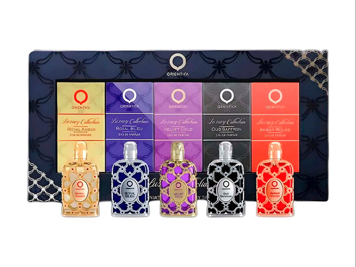 Set de 5 mini perfumes Orientica en colores dorado, azul, morado, negro y rojo con estuche decorativo.