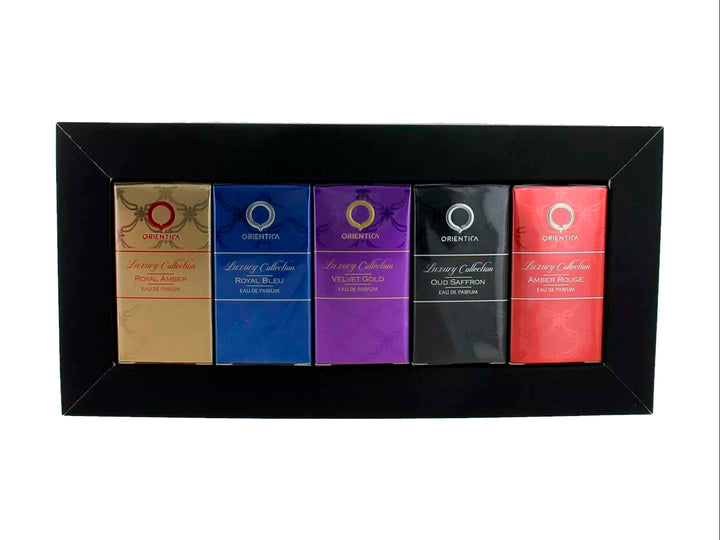 Set de 5 mini perfumes Orientica en colores dorado, azul, morado, negro y rojo con estuche decorativo.