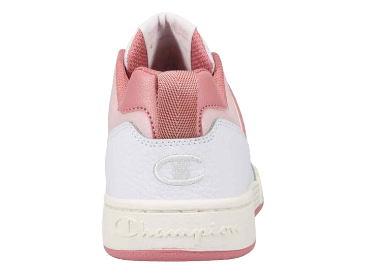 Tenis deportivos Champion de corte bajo en color blanco con detalles en rosa y suela blanca y rosa.