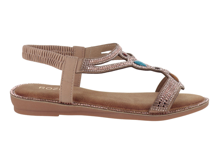Sandalia plana color rose gold con detalles brillantes y correa al tobillo.