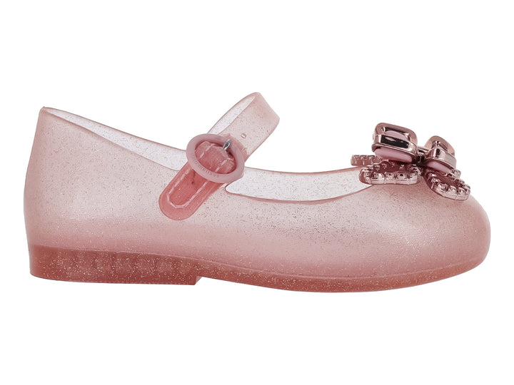 Zapato infantil Mini Melissa color rosa brillante con moño decorativo y correa ajustable.