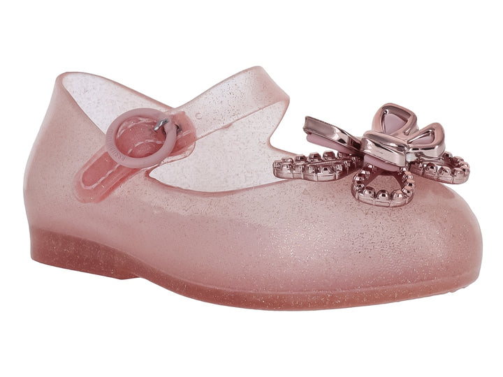 Zapato infantil Mini Melissa color rosa brillante con moño decorativo y correa ajustable.