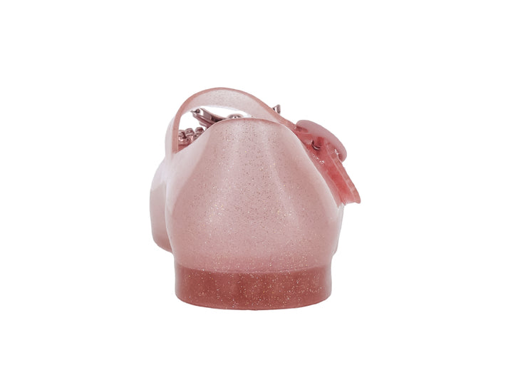 Zapato infantil Mini Melissa color rosa brillante con moño decorativo y correa ajustable.