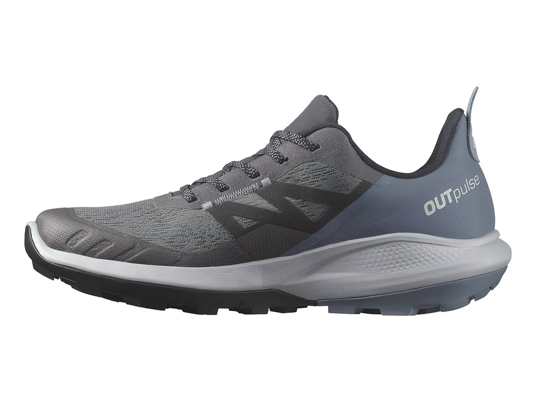 Tenis deportivos Salomon en tonos gris y azul con suela blanca y negra.