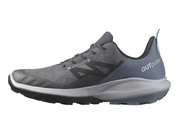 Tenis deportivos Salomon en tonos gris y azul con suela blanca y negra.