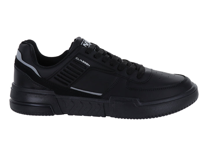 Tenis casuales color negro con detalles en gris y suela gruesa.