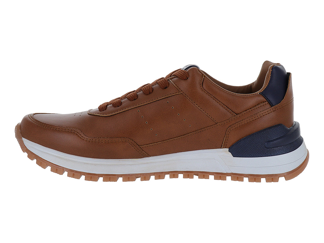 Zapato casual color camel con detalles en azul marino y suela blanca para niño.