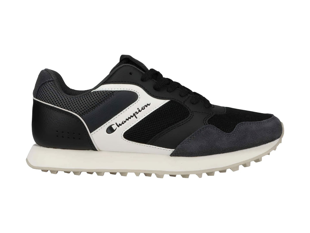 Tenis deportivos Champion en colores negro y gris con suela blanca y detalles laterales en blanco.