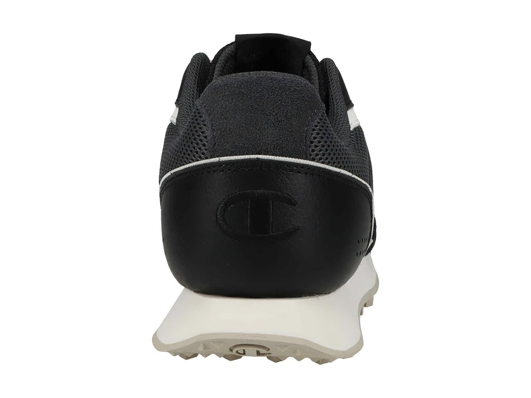 Tenis deportivos Champion en colores negro y gris con suela blanca y detalles laterales en blanco.