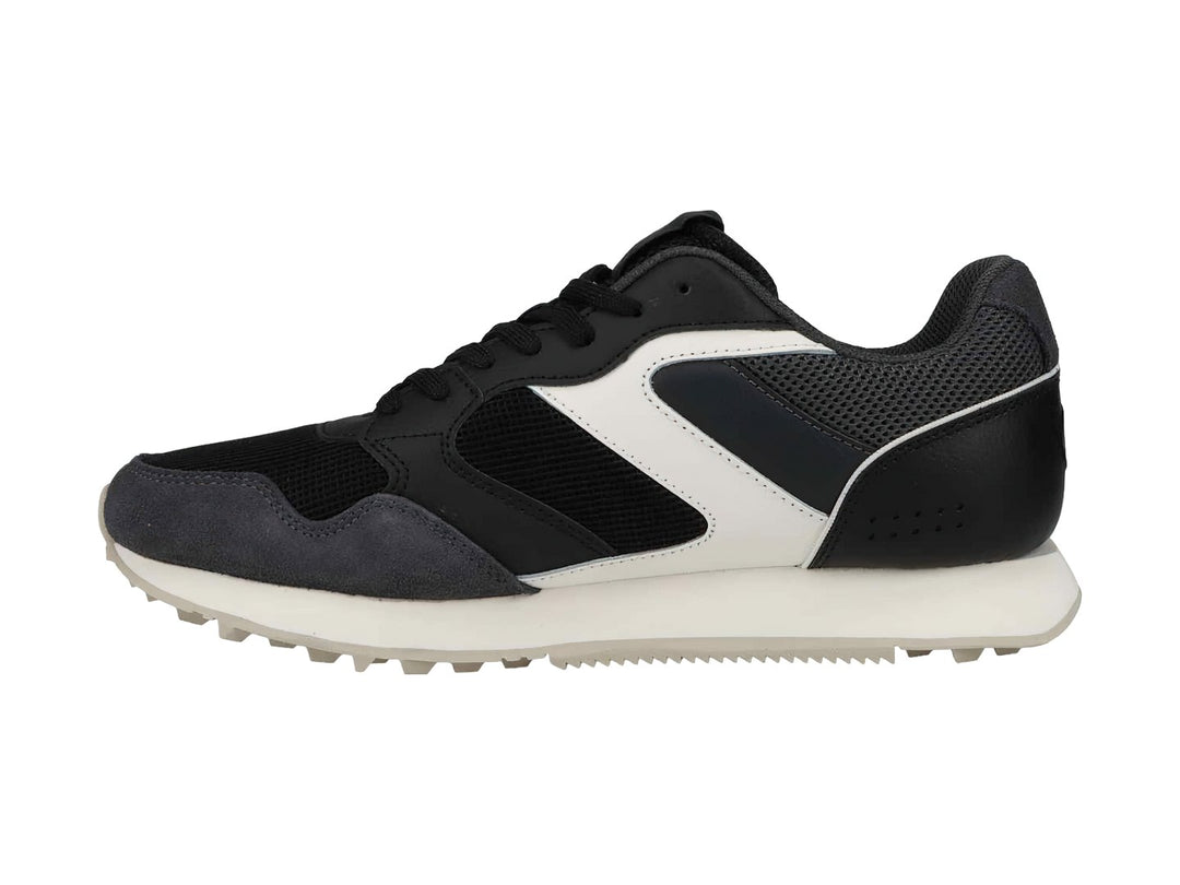Tenis deportivos Champion en colores negro y gris con suela blanca y detalles laterales en blanco.
