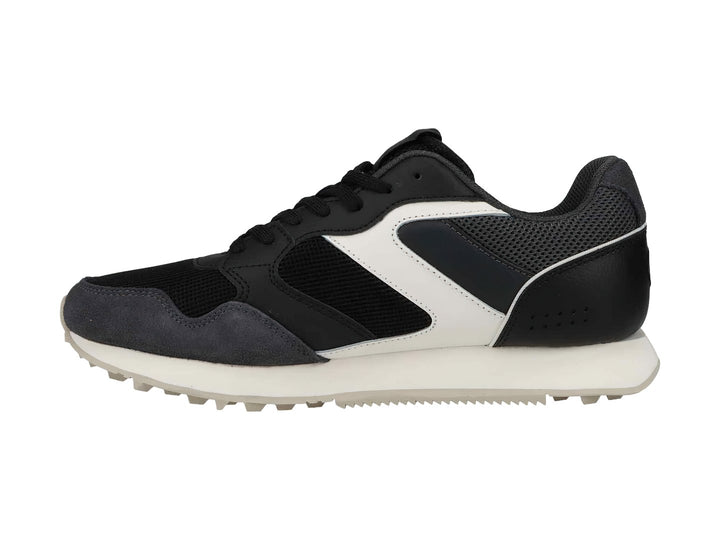 Tenis deportivos Champion en colores negro y gris con suela blanca y detalles laterales en blanco.