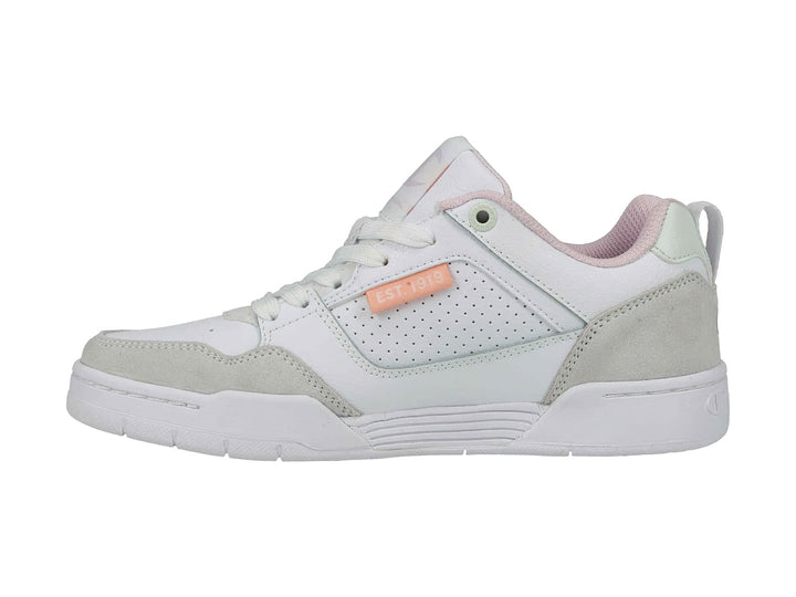 Tenis Champion blancos con detalles en gris y tonos pastel, diseño de corte bajo.