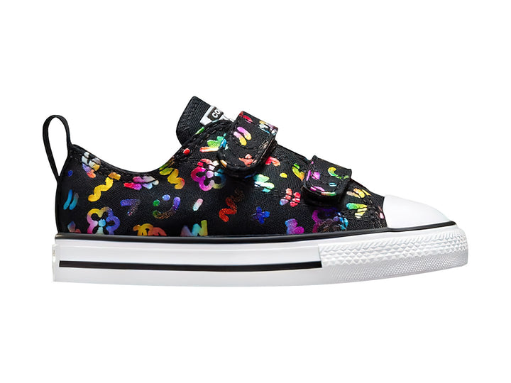 Tenis Converse negros con figuras multicolores, suela blanca y cierres de velcro para público Unisex.