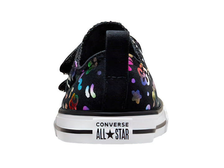 Tenis Converse negros con figuras multicolores, suela blanca y cierres de velcro para público Unisex.