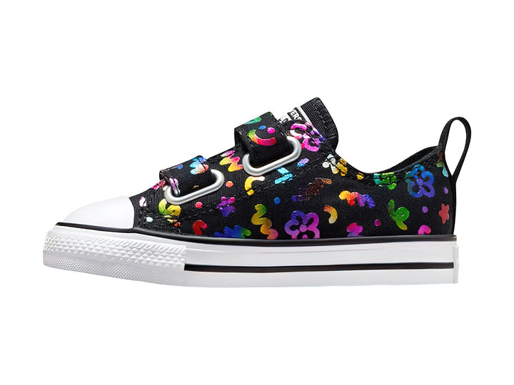 Tenis Converse negros con figuras multicolores, suela blanca y cierres de velcro para público Unisex.