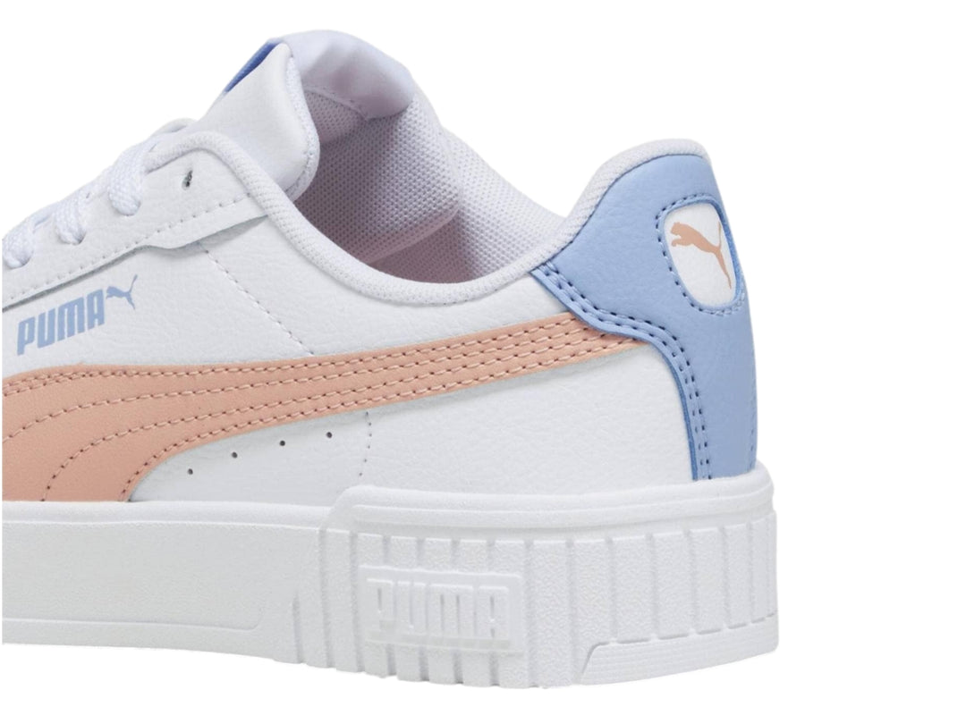 Tenis PUMA Carina 2.0 JR en color blanco con franja rosa y detalles en azul claro, suela de plataforma blanca.