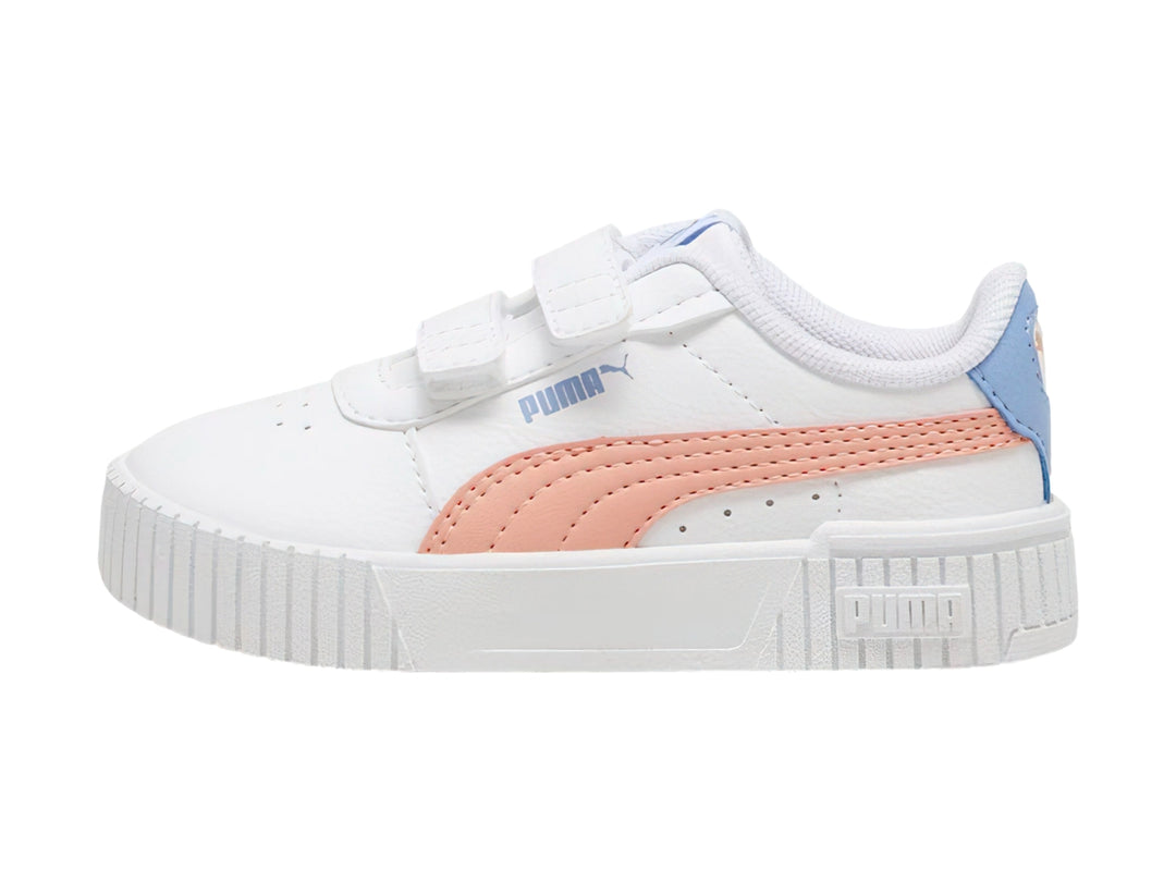 Tenis PUMA blancos para niña con detalles en rosa y azul y cierre de velcro.