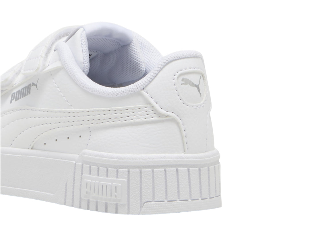 Tenis PUMA blancos para niños con cierre de velcro y suela de plataforma.