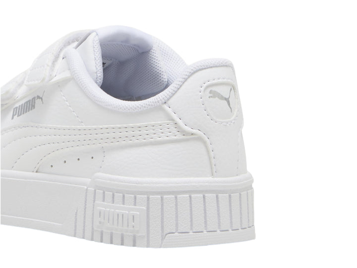 Tenis PUMA blancos para niños con cierre de velcro y suela de plataforma.