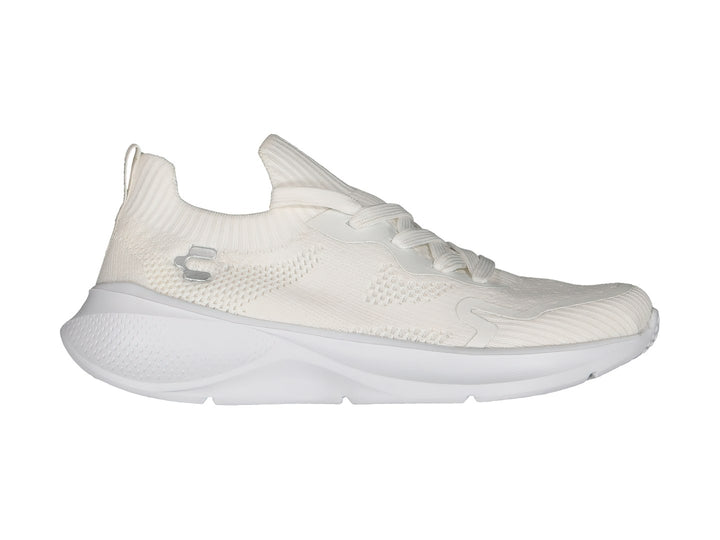 Tenis deportivos Charly color blanco con parte superior tejida y suela blanca.