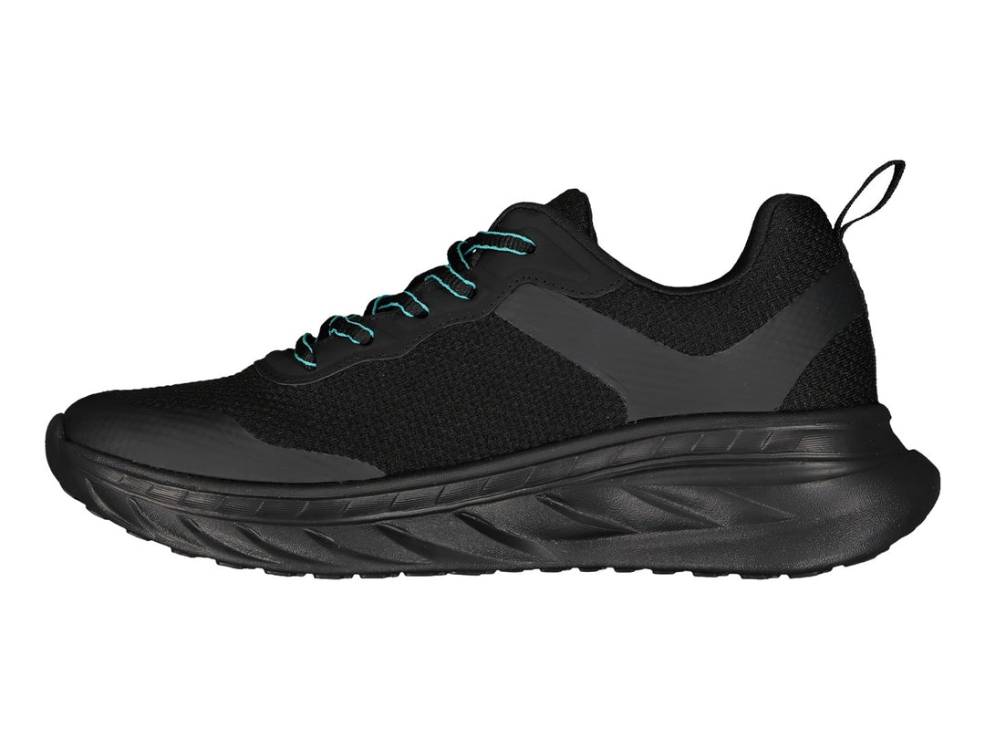 Tenis deportivos Charly color negro con detalles y logo en color turquesa.