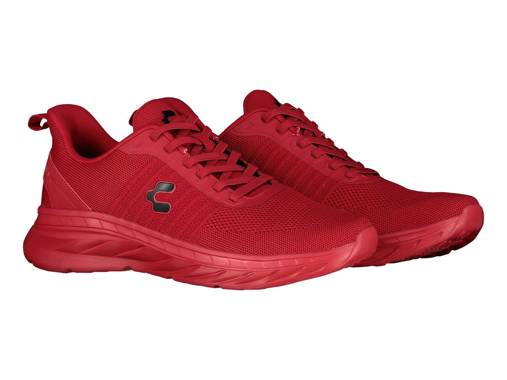 Tenis deportivos marca Charly en color rojo sólido con suela a juego y tejido transpirable.